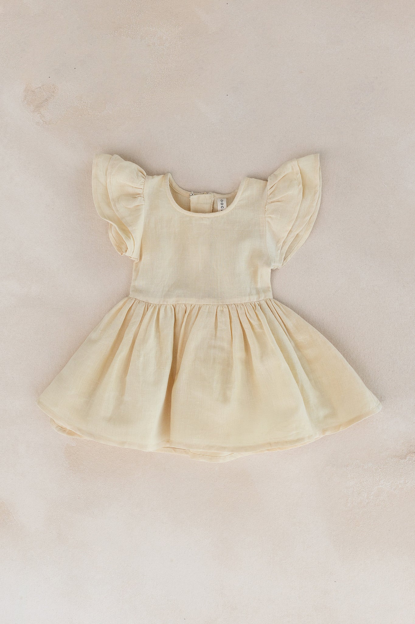 Buttercup Creme Flutter Sleeve Dress